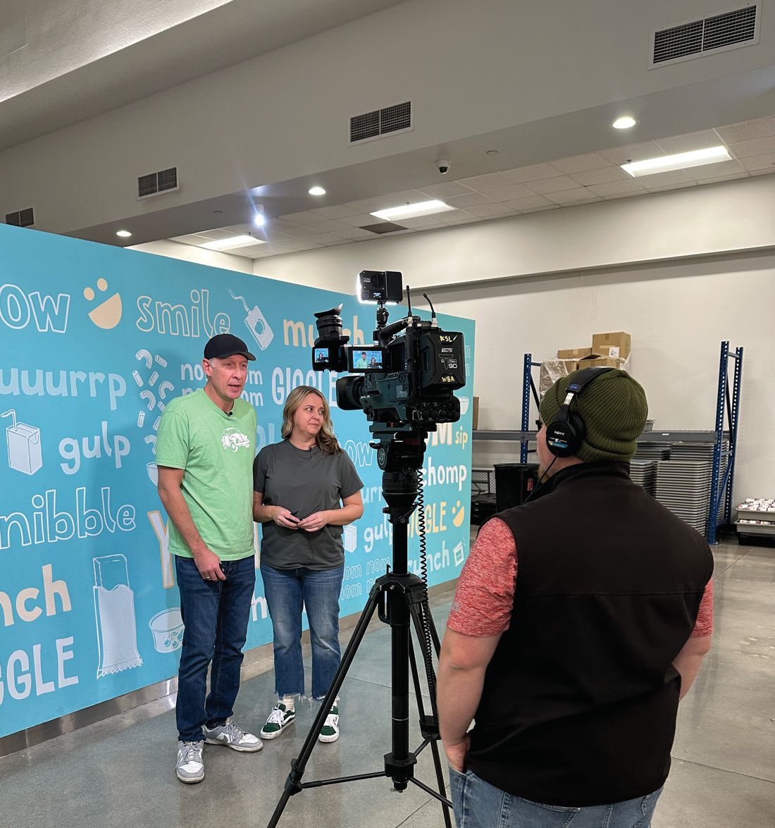 A TV crew covers the packing event