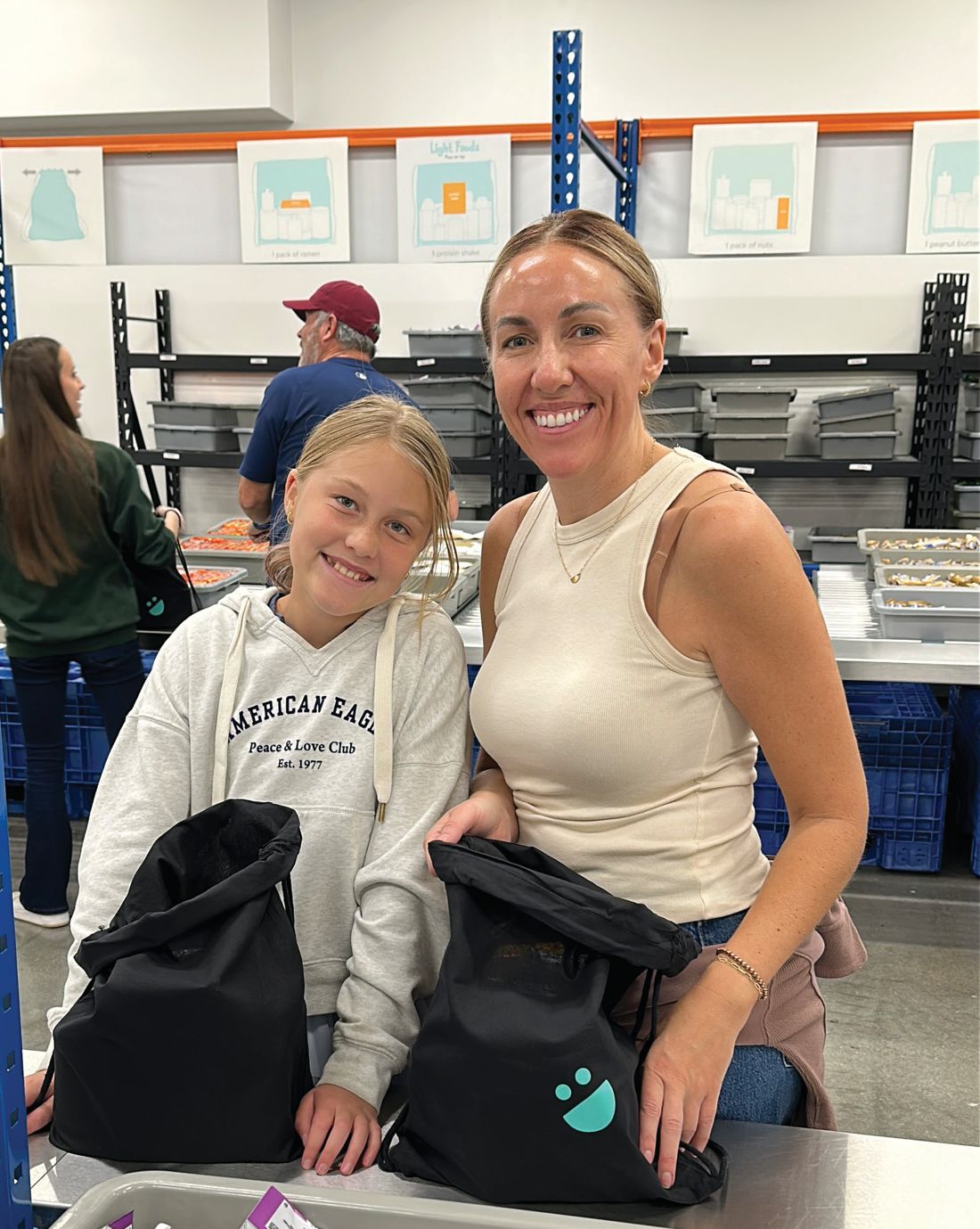 A mother and daughter packing bags