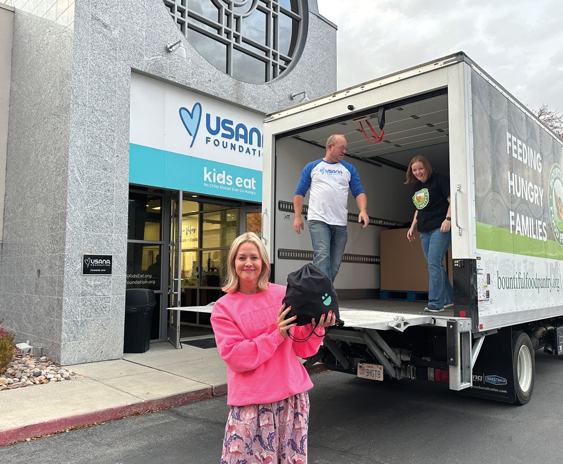 Volunteers load the USANA box truck