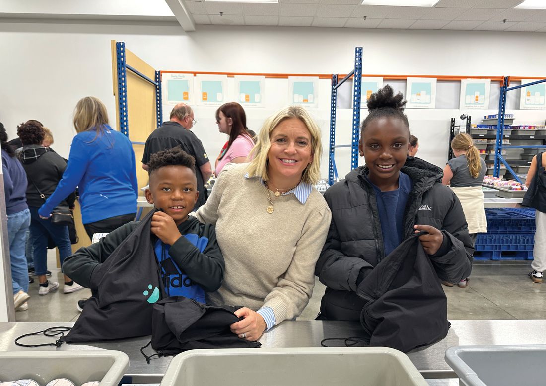 Volunteers with bags at the packing tables