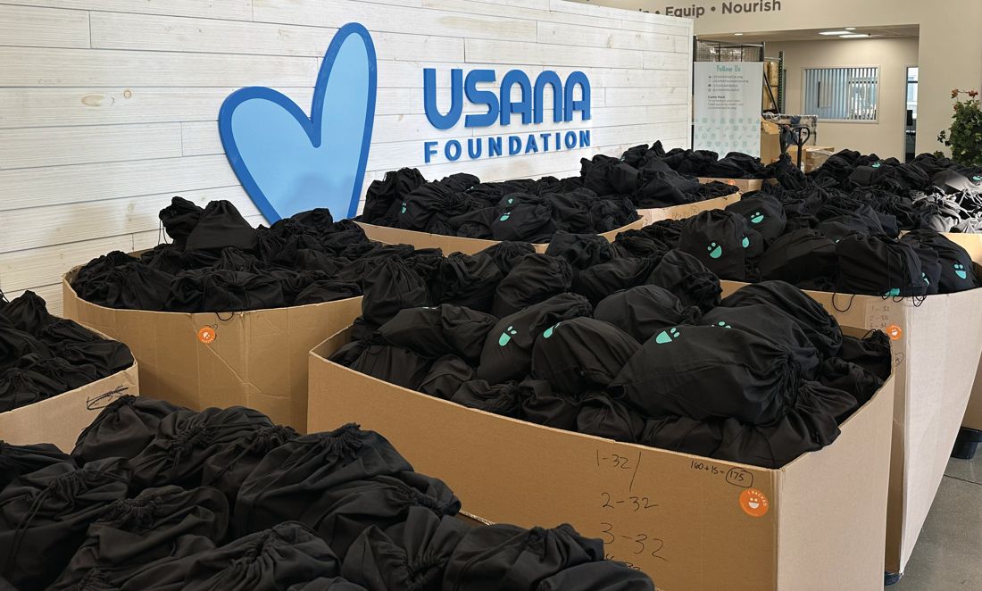 Pallets of USANA Kids Eat weekend bags ready for summer delivery